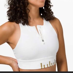 White sports bra with high neck and zipper detail